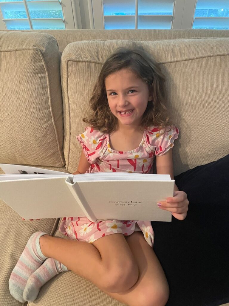 My daughter looking through one of our family photo albums